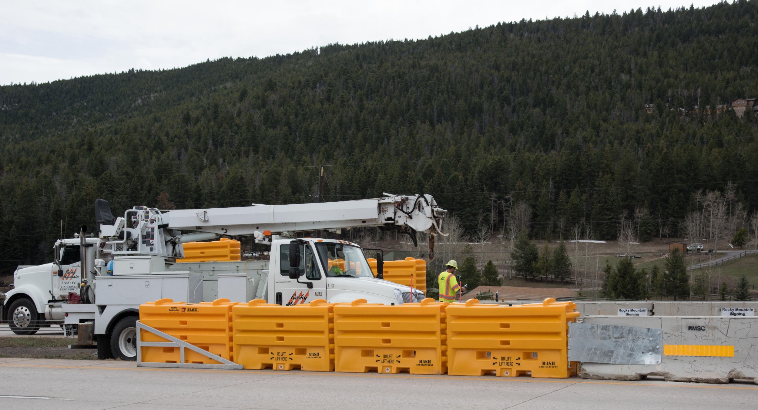 Truck and Workers Placing Barricade Rental Denver